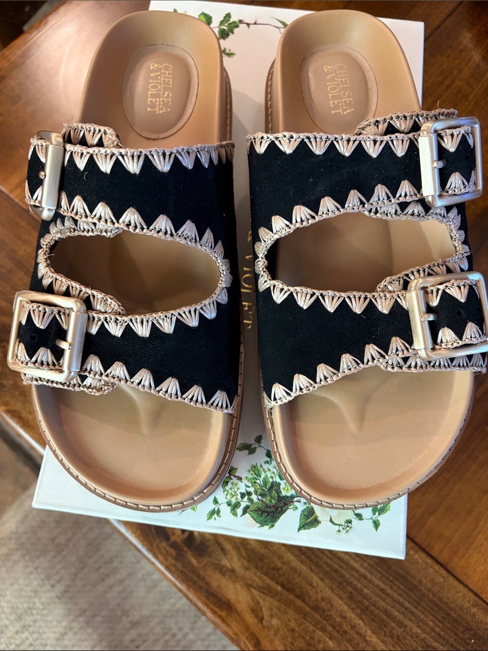 Chelsea & Violet Black Slide Sandals with Cream Stitching and Silver Buckles